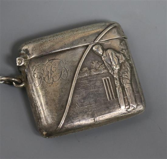 An Edwardian silver vesta case, embossed with a cricketer at the crease, Boots Pure Drug Company, Birmingham, 1907.